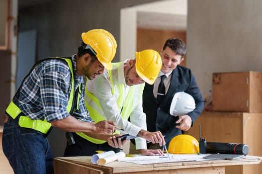 Civil Construction team working at renovate construction site. architectural plan, engineer sketching a construction project, green energy concept