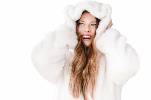 Winter fashion and beauty, beautiful woman in white fur coat.