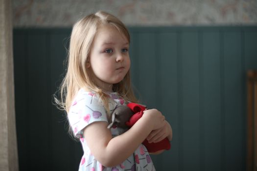 Portrait of a lovely little girl at home. Attractive lovely sweet curious cheerful smart toddler girl.