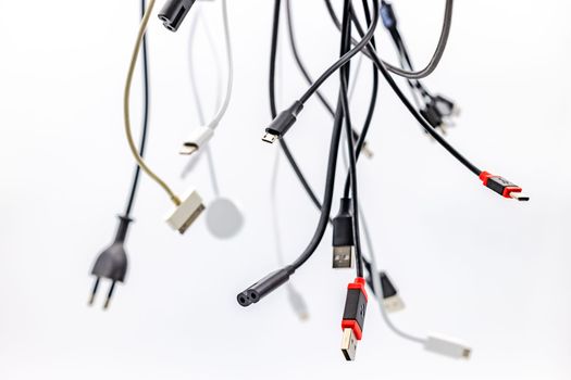 Studio shot of USB plugs and cables with type A and type C exposed in studio against white background