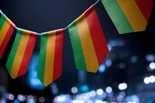 A garland of Bolivia national flags on an abstract blurred background.