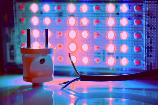 a semiconductor diode which glows when a voltage is applied. Electrical equipment for connection. Three core electric cable and lighting LED lamp.