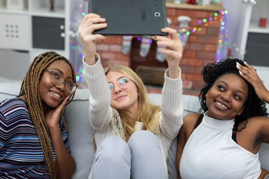 A shared selfie of college friends by a decorated fireplace. Christmas spent among friends from Africa and Europe.