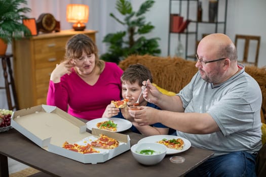 The family has one last piece of delicious pizza left and everyone is craving it.