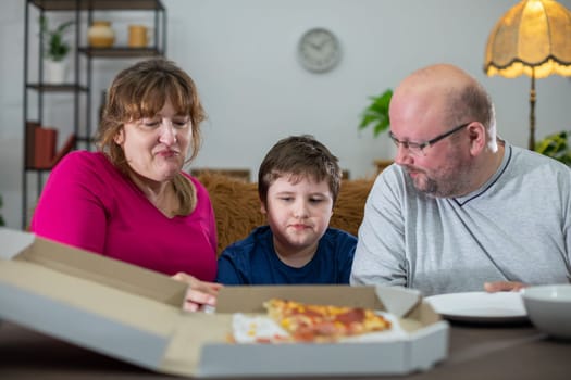 The bellies of the whole family were filled with wonderful pizza. There were still a few pieces of tasty pizza left.
