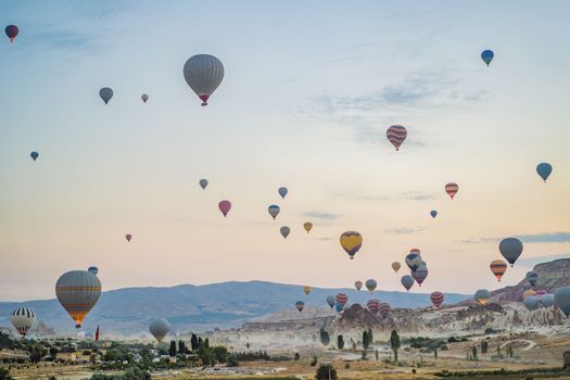 Colorful hot air balloon flying over Cappadocia, Turkey.