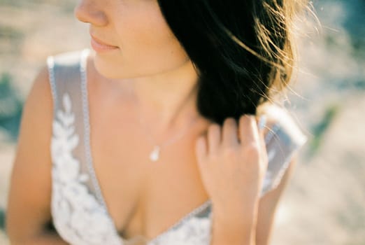 Half face of the bride in a white dress. Cropped. High quality photo