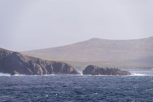Automated lighthouse on cliffs by Cape Horn is southermost warning light