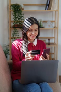 E-Business, Online shopping concept. Asian woman makes a purchase online shopping with credit card