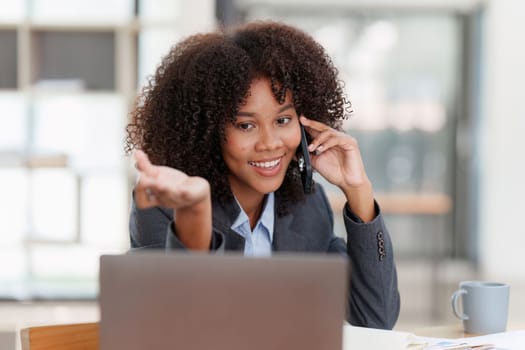 American african business woman talking on the mobile phone. Management, planning and networking phone call concept