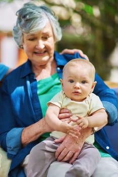 The love between a grandmother and grandson is forever. a baby boy with his family outdoors