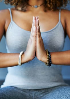 In the here and now. a young woman practising yoga by herself