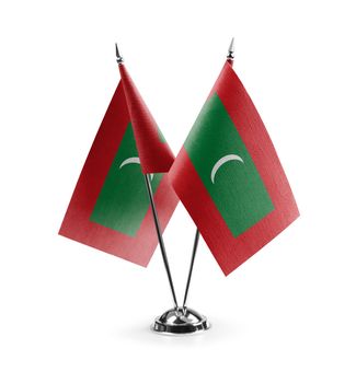 Small national flags of the Maldives on a white background.