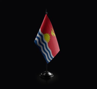 Small national flag of the Kiribati on a black background.