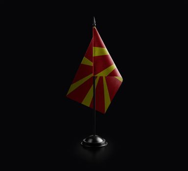 Small national flag of the Macedonia on a black background.
