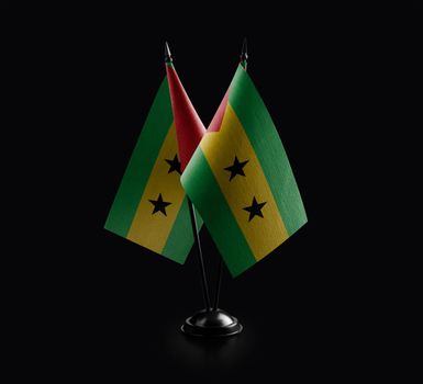 Small national flags of the Sao Tome and Principe on a black background.