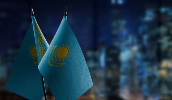 A small Kazakhstan flag on an abstract blurry background.