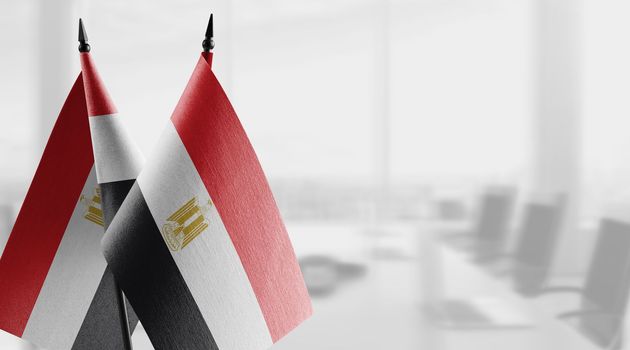 A small Egypt flag on an abstract blurry background.