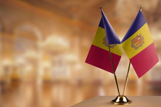 A small Andorra flag on an abstract blurry background.