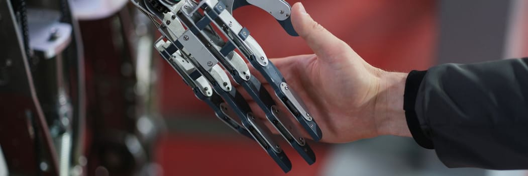 Robot extends its hand to woman for handshake. Artificial intelligence concept business design