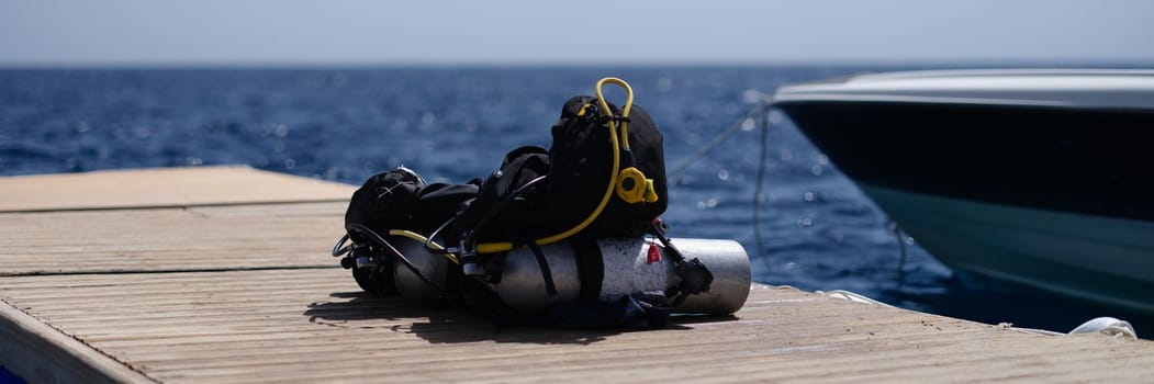 Oxygen tank with vest and diving accessories set. Diving training in sea concept
