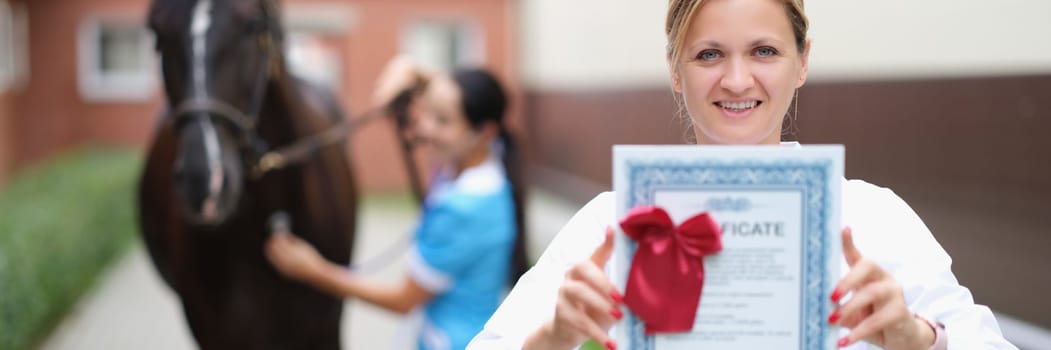 Veterinarian conducts medical examination of sports horse closeup. Veterinary documents and equestrian medical certificate concept