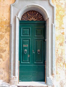 close up retro style old house door of Mediterranean architectural culture in Mediterranean island Malta. High quality photo