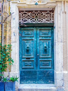 close up retro style old house door of Mediterranean architectural culture in Mediterranean island Malta. High quality photo