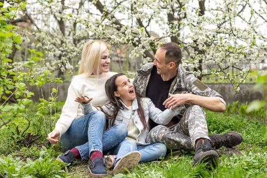 Handsome soldier reunited with family on a sunny day