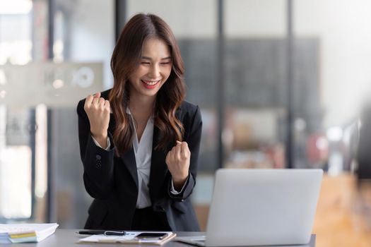Happy female office employee read pleasant e-mail on laptop, get career advancement, promoted, celebrate salary growth, receive fantastic news with sell-out, professional successt.