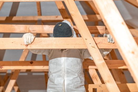 work on the attic of the house, insulated with glass wool. High quality photo