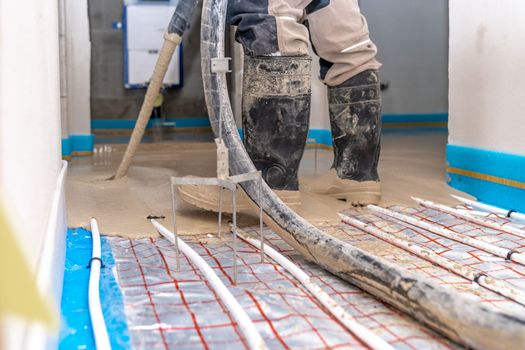 covering the floor heating with anhydride and concrete. High quality photo