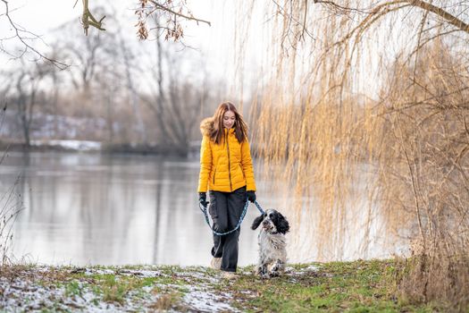 teenager with a dog on a walk in the park. High quality photo