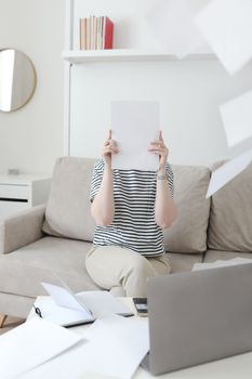 Creative photo of a busy business woman working with documents at workplace in a modern office. office manager or freelancer in a stylish room.
