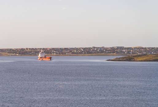 Oil or gas tanker leaving port of Stanley on the Falkland Islands as it heads to ocean
