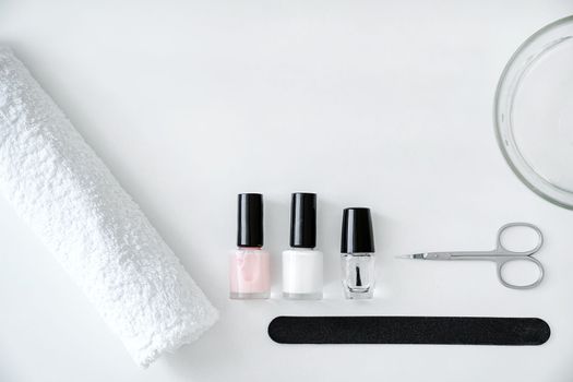 Concept of nail and hand care, manicure accessories on a white background, flat lay, top view, copy space