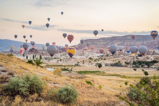 Colorful hot air balloon flying over Cappadocia, Turkey.