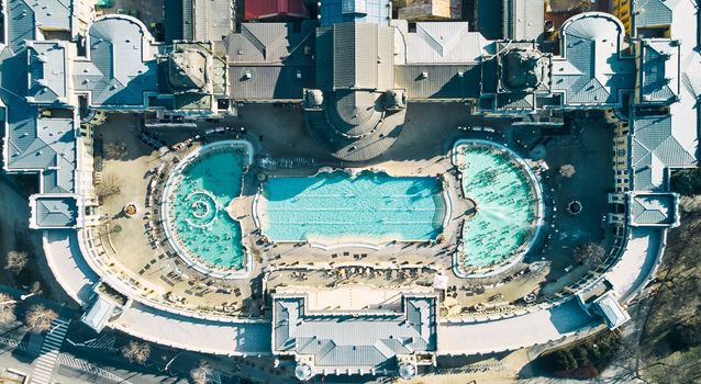 Aerial drone view of the famous Szechenyi Thermal Bath and Spa on a sunny autumn day in Budapest, Hungary. High quality photo