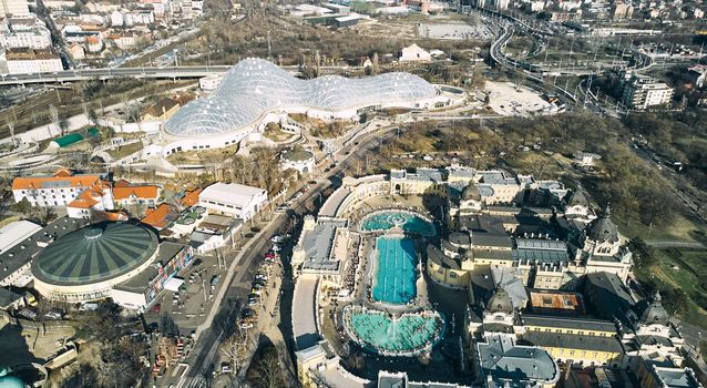 Budapest, Hungary - February 10, 2023: Aerial drone view of the famous Szechenyi Thermal Bath and Spa on a sunny autumn day in Budapest, Hungary. High quality photo