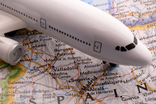 Passenger plane on a map highlighting Rome, Italy through selective focus, background blur. High quality photo