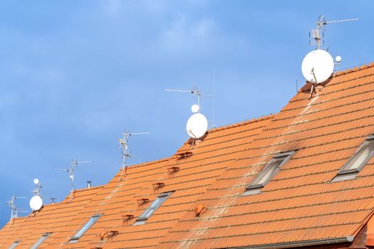 red roofs of family houses with antennas. High quality photo
