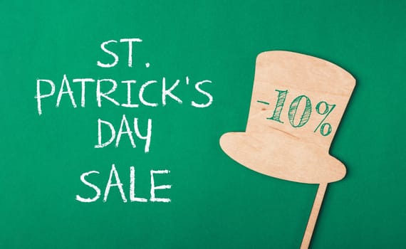 -10 discount on Patrick's Day holiday on paper green background. Enjoy the shopping. Template for design