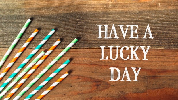 Have A Lucky Day on a wooden background. High quality photo
