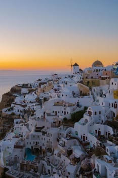 White churches an blue domes by the ocean of Oia Santorini Greece, a traditional Greek village in Santorini. 