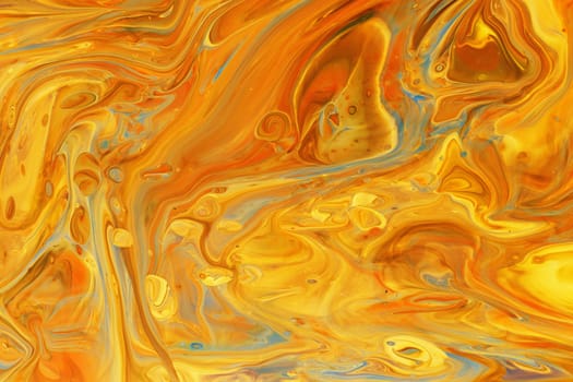 Golden orange and yellow abstract fluid art background of acrylic paint, with marbling effect, colorful bubbles and copy space