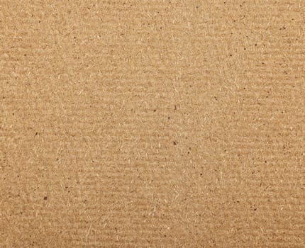 Close up background texture of unpainted natural brown wooden fiberboard plate, sheet construction material also used for furniture production