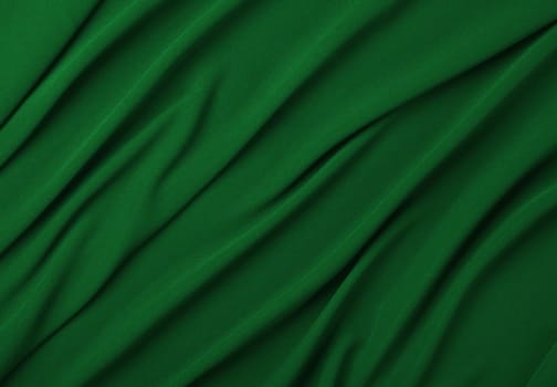 Close up abstract textile background of dark green folded pleats of fabric, elevated top view, directly above