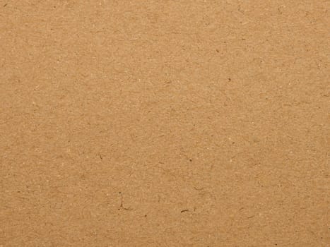 Close up natural brown paper parchment background texture with dark nap fibers pattern for design craft