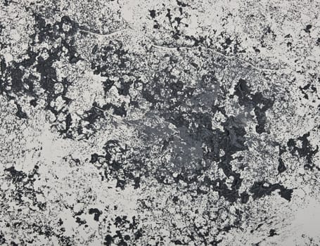 Close up abstract grunge black and white background with brushstrokes, stains and splatter pattern