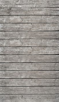 Old gray vintage rustic weathered wooden fence planks background
